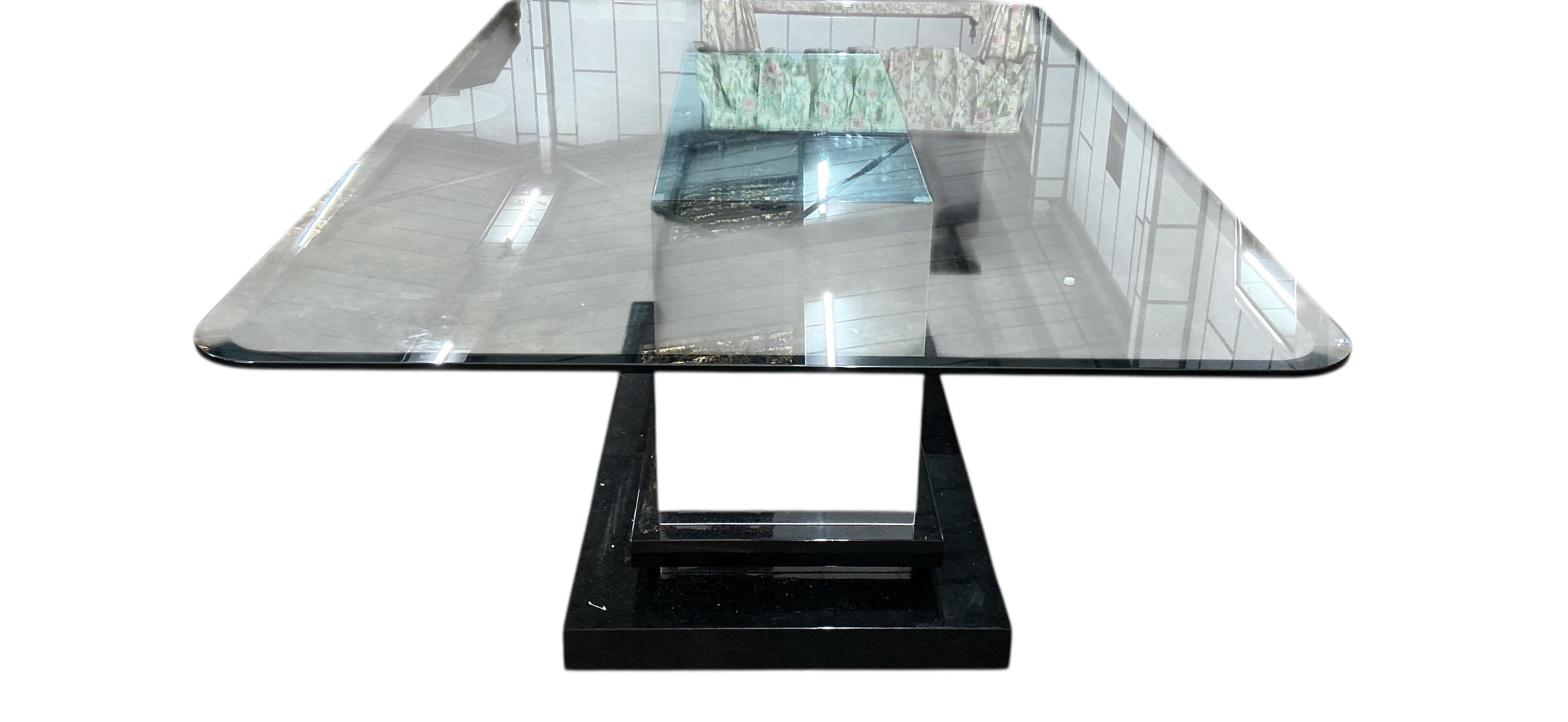 A Contemporary rectangular glass dining table on central mirrored block with ebonised plinth foot, width 200cm, depth 130cm, height 75cm